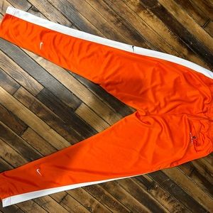 Orange Nike sweatpants